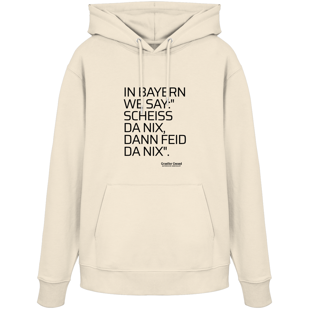 Naturfarbener Hoodie mit schwarzem Schriftzug "In Bayern we say: Scheiß da nix, dann feid da nix" im minimalistischen bayerischen Streetwear-Design von Grantler Gwand.