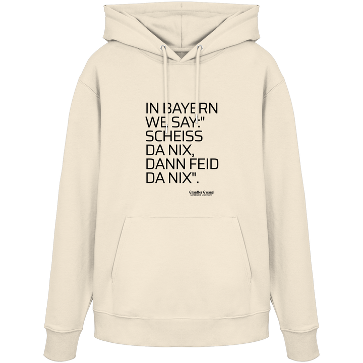 Naturfarbener Hoodie mit schwarzem Schriftzug "In Bayern we say: Scheiß da nix, dann feid da nix" im minimalistischen bayerischen Streetwear-Design von Grantler Gwand.
