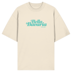 Cremefarbenes Oversize-T-Shirt in Bio Qualität mit grünem „Bella Bavaria“-Frontprint – bayerische Streetwear von Grantler Gwand im modernen, minimalistischen Look.